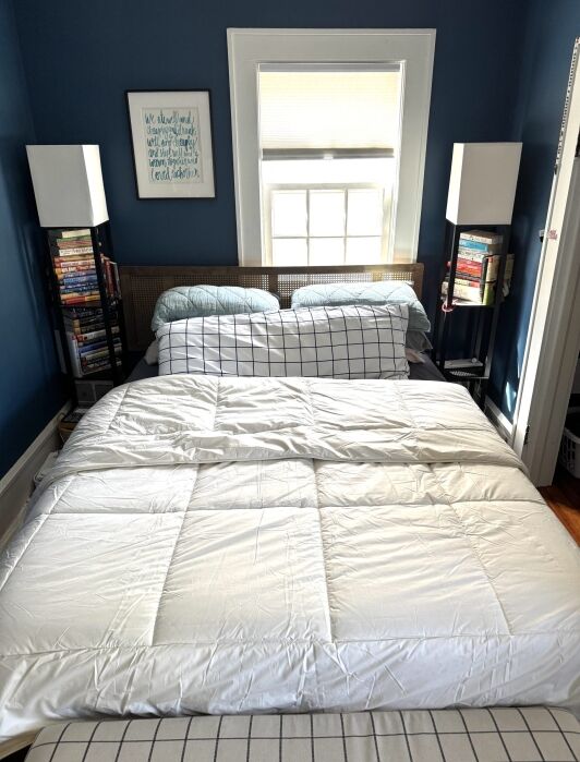 A Naturepedic duvet insert comforter on a bed.