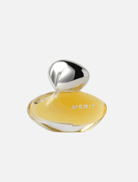 Merit perfume bottle with an amber liquid and a silver, sculptural cap.