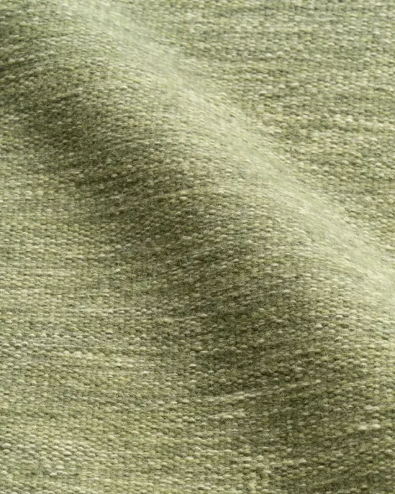 Close-up view of textured, sage-green woven fabric.