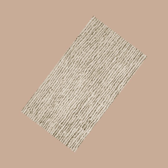 Rectangular, cream-colored area rug with a thick, woven texture.