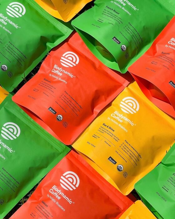 A studio shot of Holistic roasters bags of coffees laid out together.