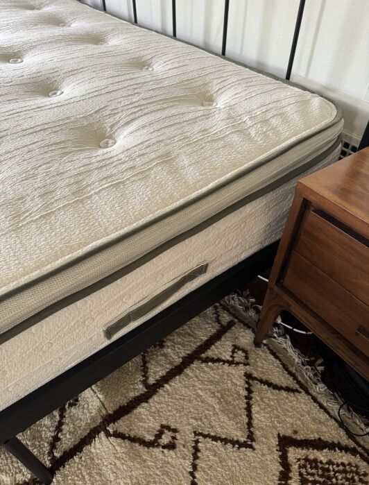 A close up of Avocado's fiberglass free mattress. 