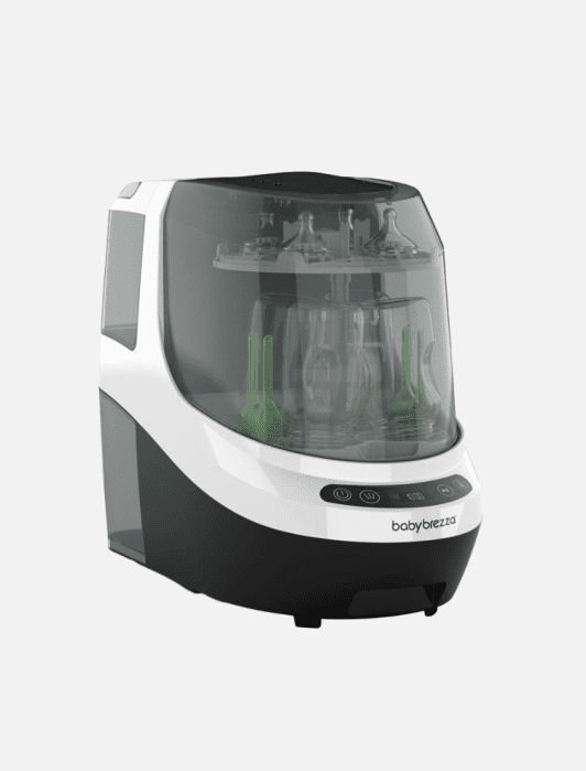 A black and white Baby Brezza bottle sterilizer and dryer with multiple baby bottles and accessories inside, displayed on a plain background.