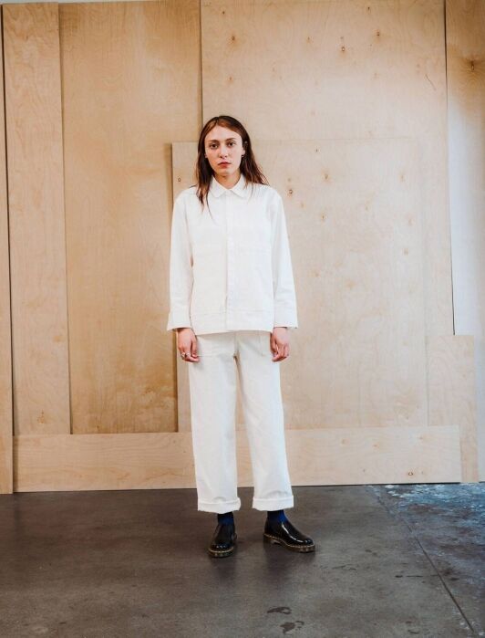 A mode wearing a white long sleeve set with matching pants from IJJI.
