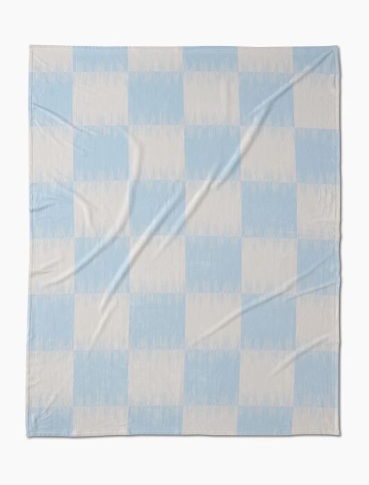 A square blanket featuring a light blue and white checkerboard pattern, displayed flat with some visible wrinkles.