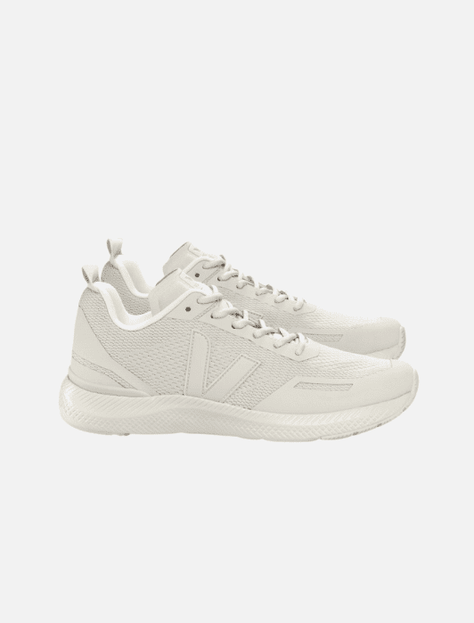 A pair of white athletic sneakers with mesh panels, lace-up closure, and textured soles, viewed from the side against a white background.