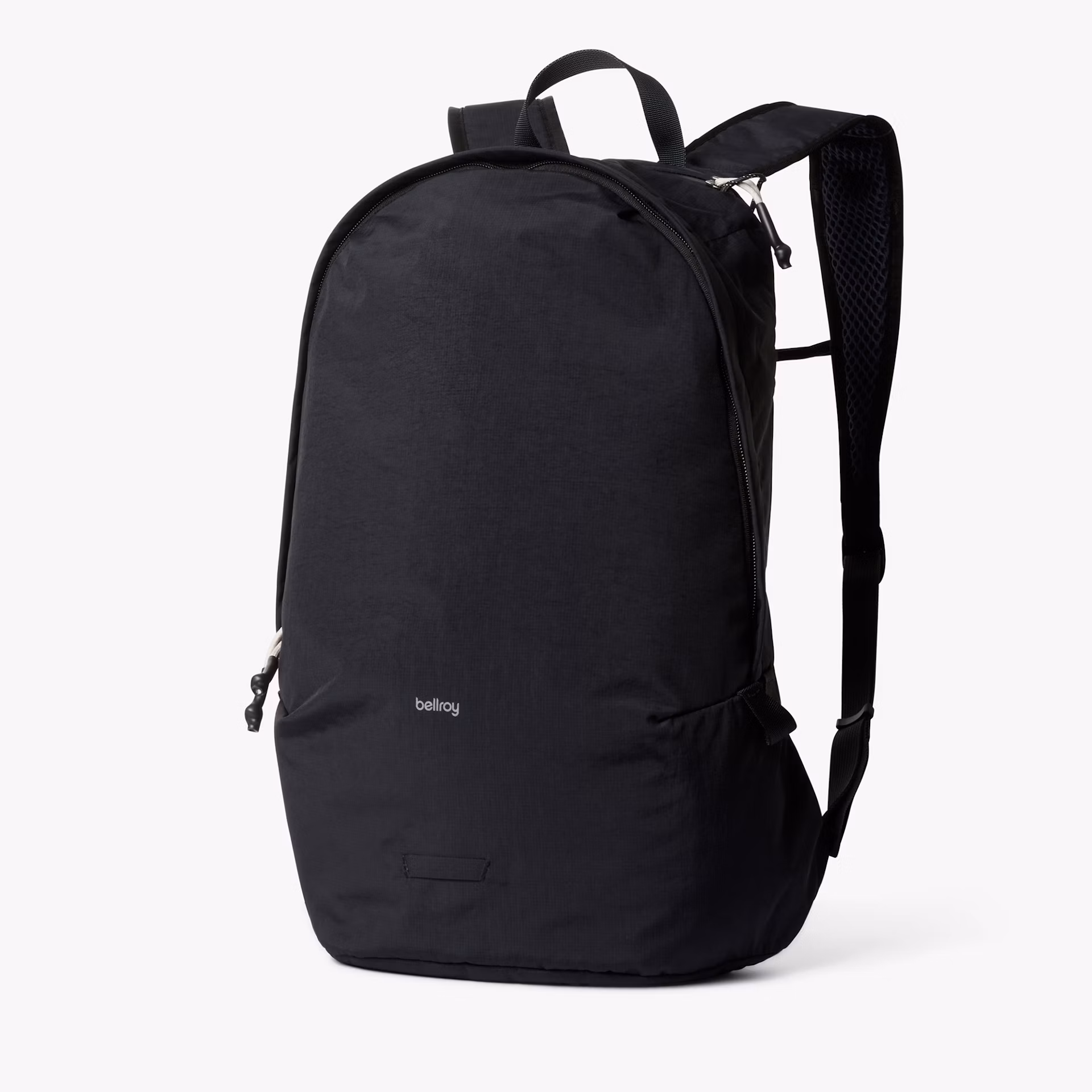 A black backpack with a curved top, adjustable straps, and a small “bellroy” logo on the front, shown on a white background.