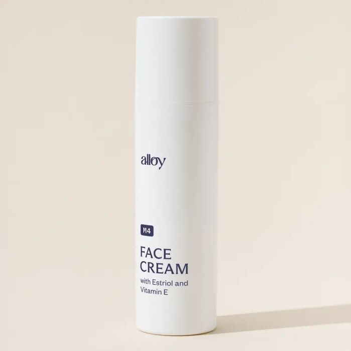 A white bottle of Alloy M4 Face Cream with Estriol and Vitamin E is shown on a neutral background.