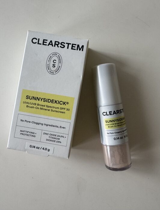 CLEARSTEM SUNNYSIDEKICK SPF 30 brush-on mineral sunscreen with packaging and product container on a white surface.