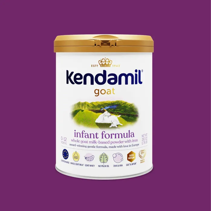 A tin of Kendamil Goat infant formula for ages 0-12 months, shown against a purple background.