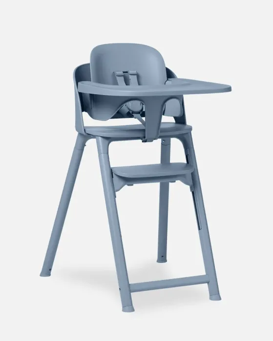 Blue plastic high chair with a tray, footrest, and safety harness, designed for babies or toddlers; set against a plain white background.