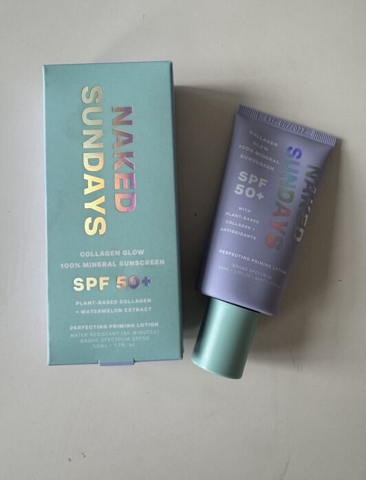 A box and tube of Naked Sundays Collagen Glow 100% Mineral Sunscreen SPF 50+, labeled as plant-based collagen with watermelon extract and antioxidants.
