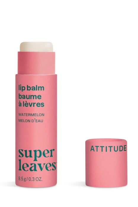 A pink tube of Watermelon Super Leaves lip balm with the cap labeled "Attitude" placed beside it.