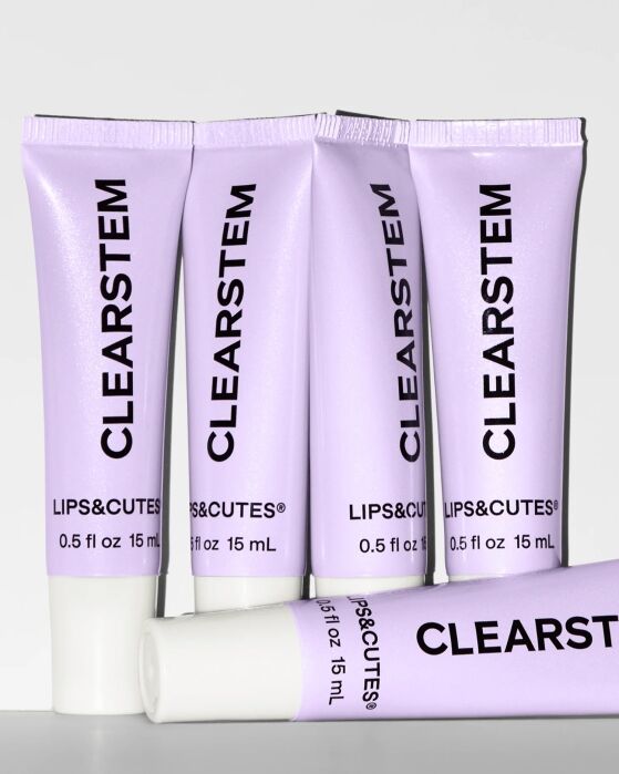Five lavender tubes of CLEARSTEM LIPS&CUTES lip balm, each labeled 0.5 fl oz / 15 mL, are arranged upright with one tube lying horizontally in front.