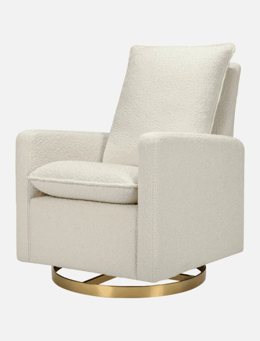 Modern cream-colored upholstered armchair with a cushioned seat and backrest, featuring a circular gold metal swivel base.