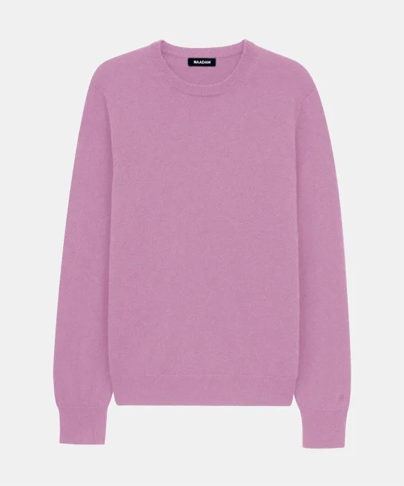 A plain, long-sleeve, crew neck sweater in a light purple color is displayed against a white background.