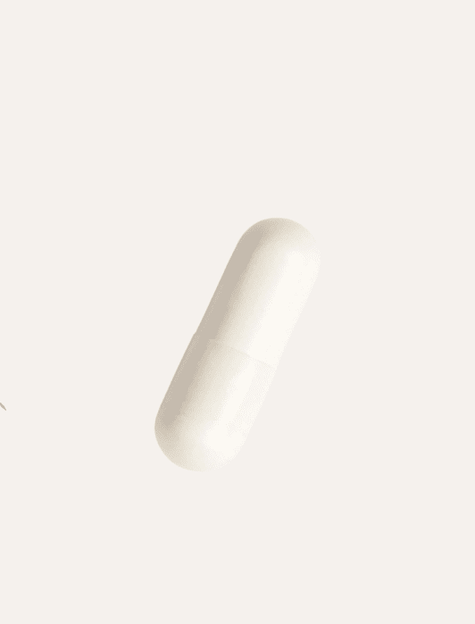 A single white capsule pill on a plain light background.